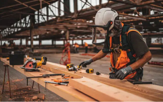 Occupational worker working on wood project - Occupational Medicine Oxnard. CA