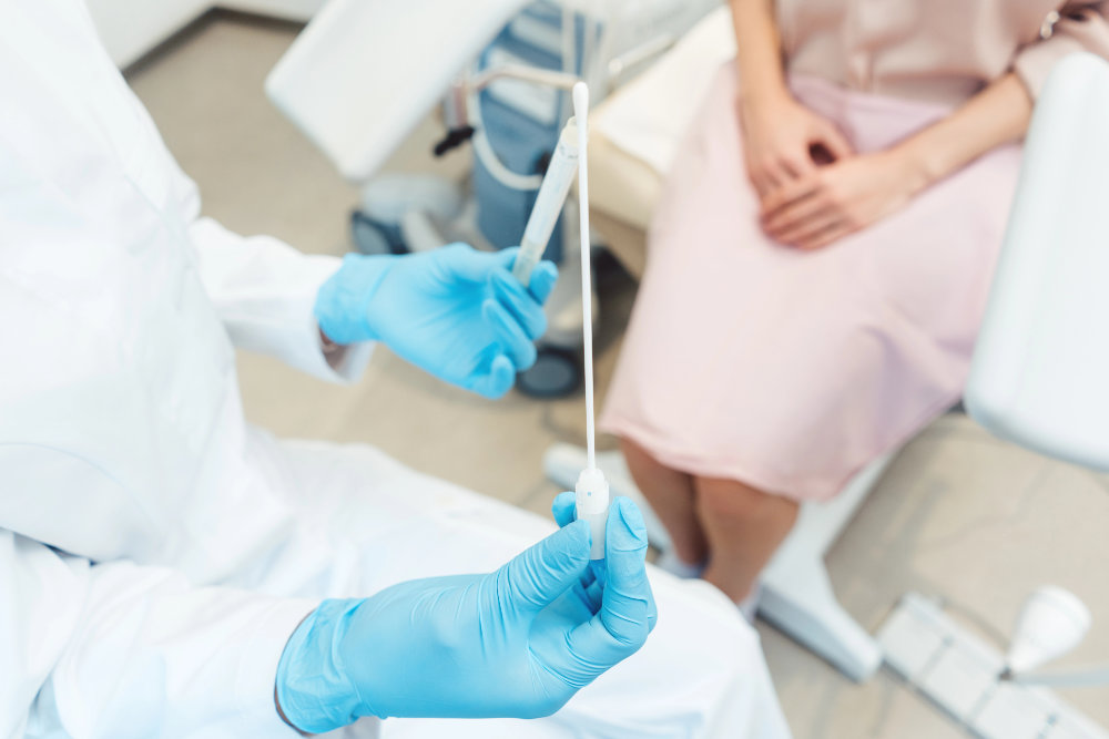 Woman having test for sexually transmitted disease with doctor Patient meeting with a provider for confidential STD testing at Solar Urgent Care in Oxnard
